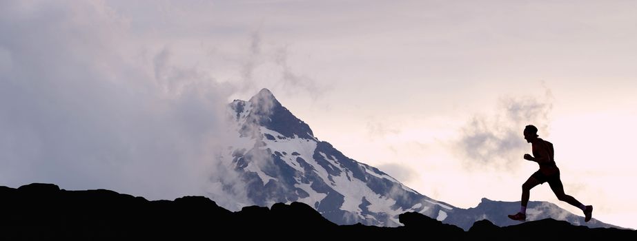 Running man athlete silhouette trail running in mountain summit background
