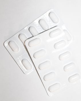 Pharmacy drugstore concept. Packs of white pills packed in blist