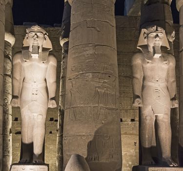 Statues of Ramses II at Luxor Temple in night