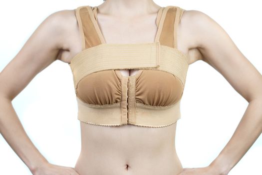 Woman posing in support bra after breast augmentation plastic su