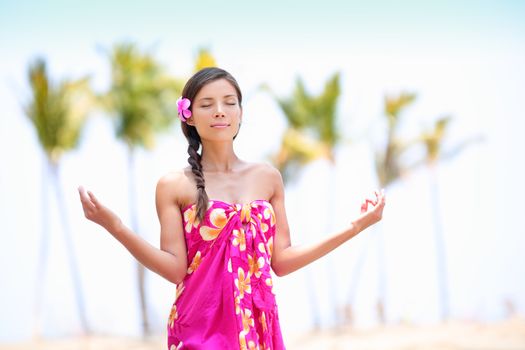 Meditation zen woman meditating on Hawaii beach