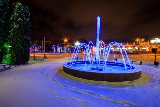 Fountain of garlands at winter season with lights