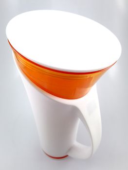 Orange and white color long plastic drinking cup with handle