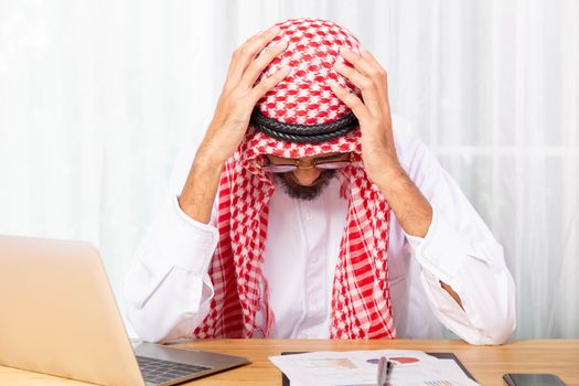 Arabian businessman feeling disappoint and suffer about his busi