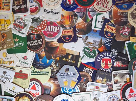LONDON - MAR 2020: Drink coasters of many beer brands