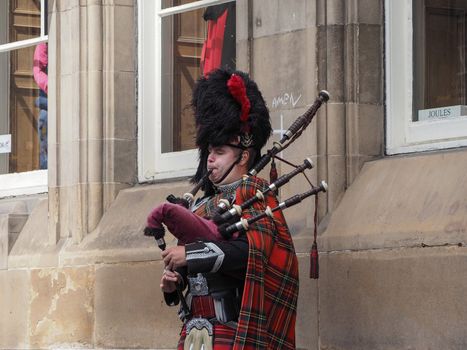 Bagpipe player busker in Edinburgh