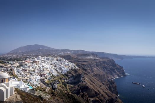 Thira city on Santorini island on a clear sunny day.