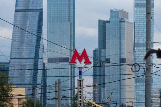 Symbol M underground transport and skyscrapers 2020