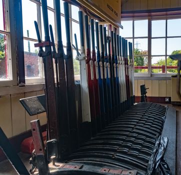 Old style railway signal box control levers