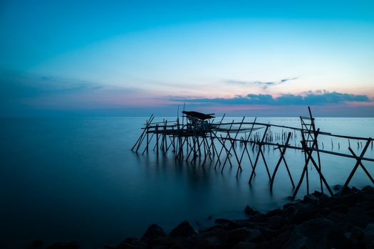 Wooden fisherman's hut in the Malacca strait during blue hour. Long exposure landscape orientation.