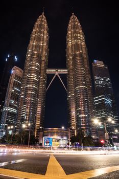 Tallest twin tower in the world; Petronas Twin Tower view at night with light trails from the traffic.