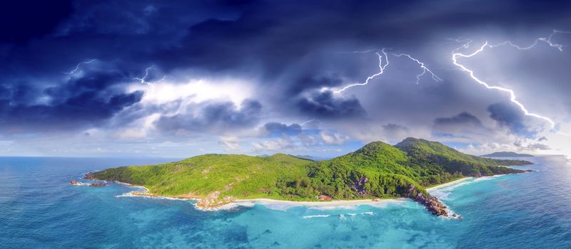 Aerial panoramic view of Tropical Island with storm approaching.