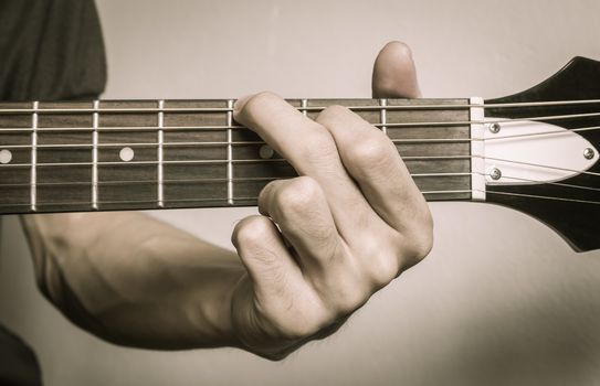 Guitar Player Hand in G Major Chord on Acoustic Guitar in Front 