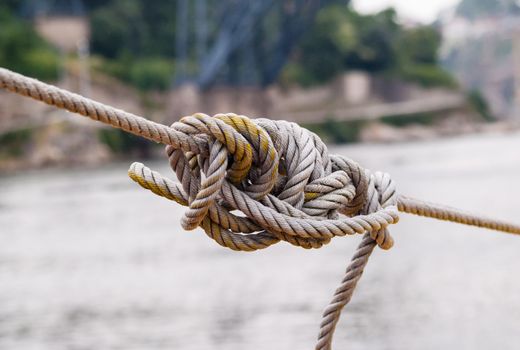 Tangled knot in tightened rope