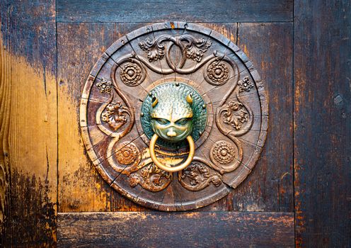 Detail of wooden door with metal handle