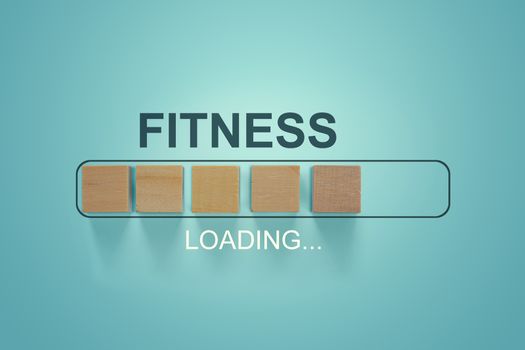 Wooden blocks with the word FITNESS in the loading bar progress concept.