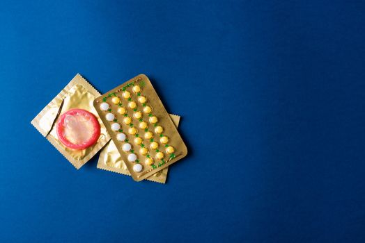condom on wrapper pack and contraceptive pills blister hormonal 