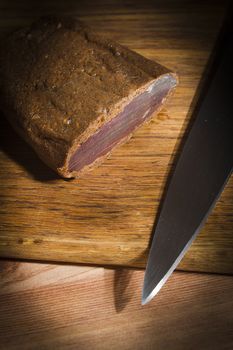 Cured meat on a wooden cutting board