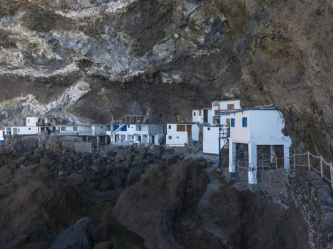 Cueva de Candelaria, Pirate cave Poris de Candelaria, small hidden fisherman village with white and blue houses, tourist attraction near Tijarafe, La Palma, Canary islands, Spain
