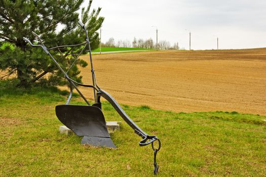 Agricultural manual plow on the grass