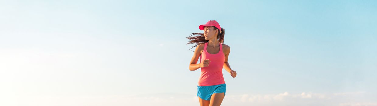 People lifestyle banner healthy woman running. Blue sky copyspace