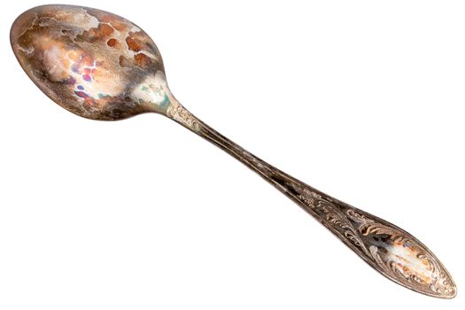 German silver or cupronickel spoon with visible oxidation layer isolated on white baclground