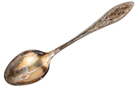 old cupronickel spoon with visible oxidation layer isolated on white background