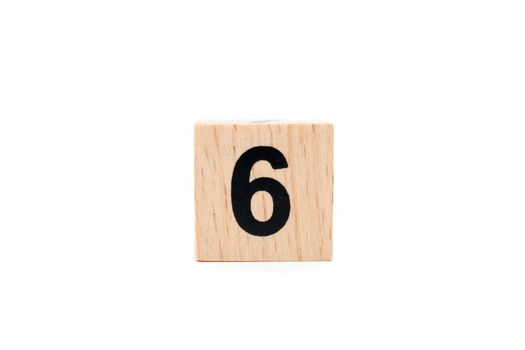 Wooden block Number six on white background