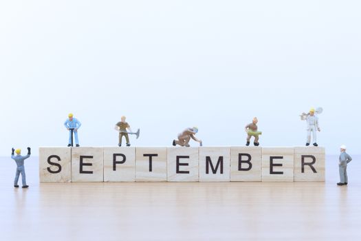 September words with Miniature people worker 