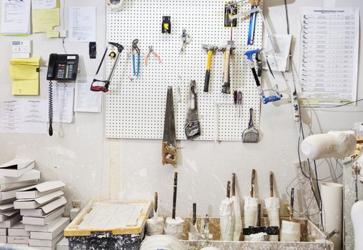 Assorted workshop tools on a pegboard