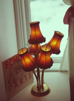 Old fashioned lamp and "Echo of Paris' advert