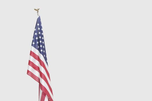 American flag over gray background