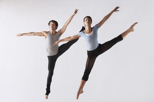 Leaping Ballet Dancers in Mid-air