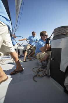 Sailing team on yacht