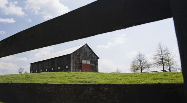 Barn in field with fence