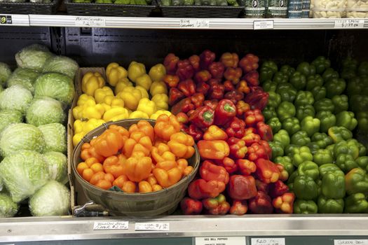 Variety of bell peppers on display for sale in market