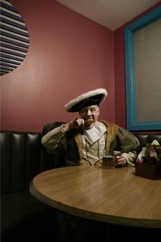 Portrait of King Henry VIII eating lunch in cafe
