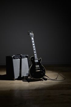 Electric guitar and amplifier on stage