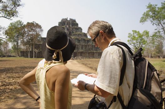 Tourists Looking at at Temple Ruins