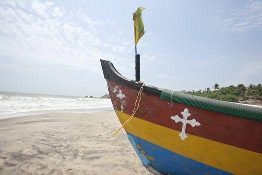 Fishing boat with crucifix sign at Anjuna Beach, Goa, India