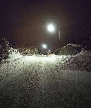 Snow-covered Street at Night
