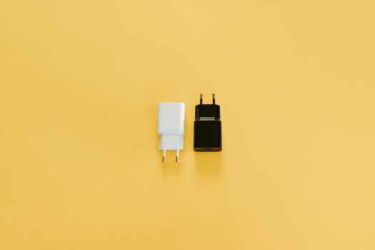 A white and a white charger over a yellow table
