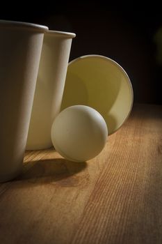 Disposable paper cups and ping pong ball