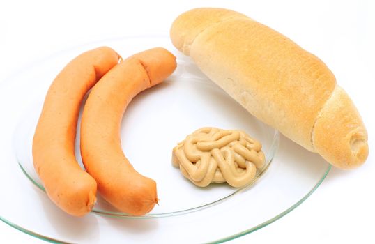 Two frankfurter sausages with mustard and bread roll