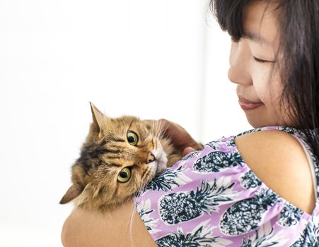 young woman holding in her arms cat