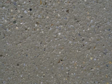 beige concrete with multi color stone grit grain natural background