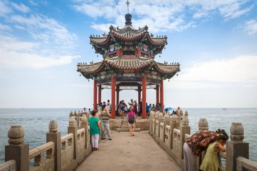 SHANHAIGUAN, CHINA - JULY 13, 2016: Old shrine at the sea. Place also called Shanhai Pass, is a part of the city of Qinhuangdao. It literally means "The Pass of Mountain and Sea".