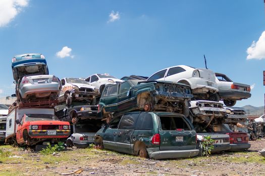 Mexico City / Mexico. June 19 2020: Old Cars Piled up in a Metal Recycling Yard Waiting to be Dismantled and Crushed.