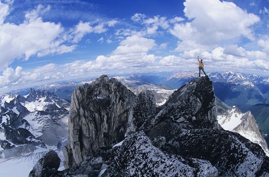 Man standing on mountain summit