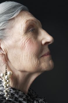 Senior Woman with Pearl Earrings